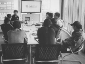 Executive protection employees around a conference table.