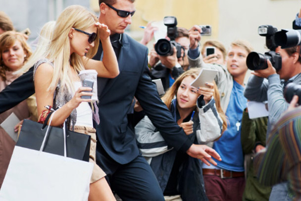 Female being escorted by security agent