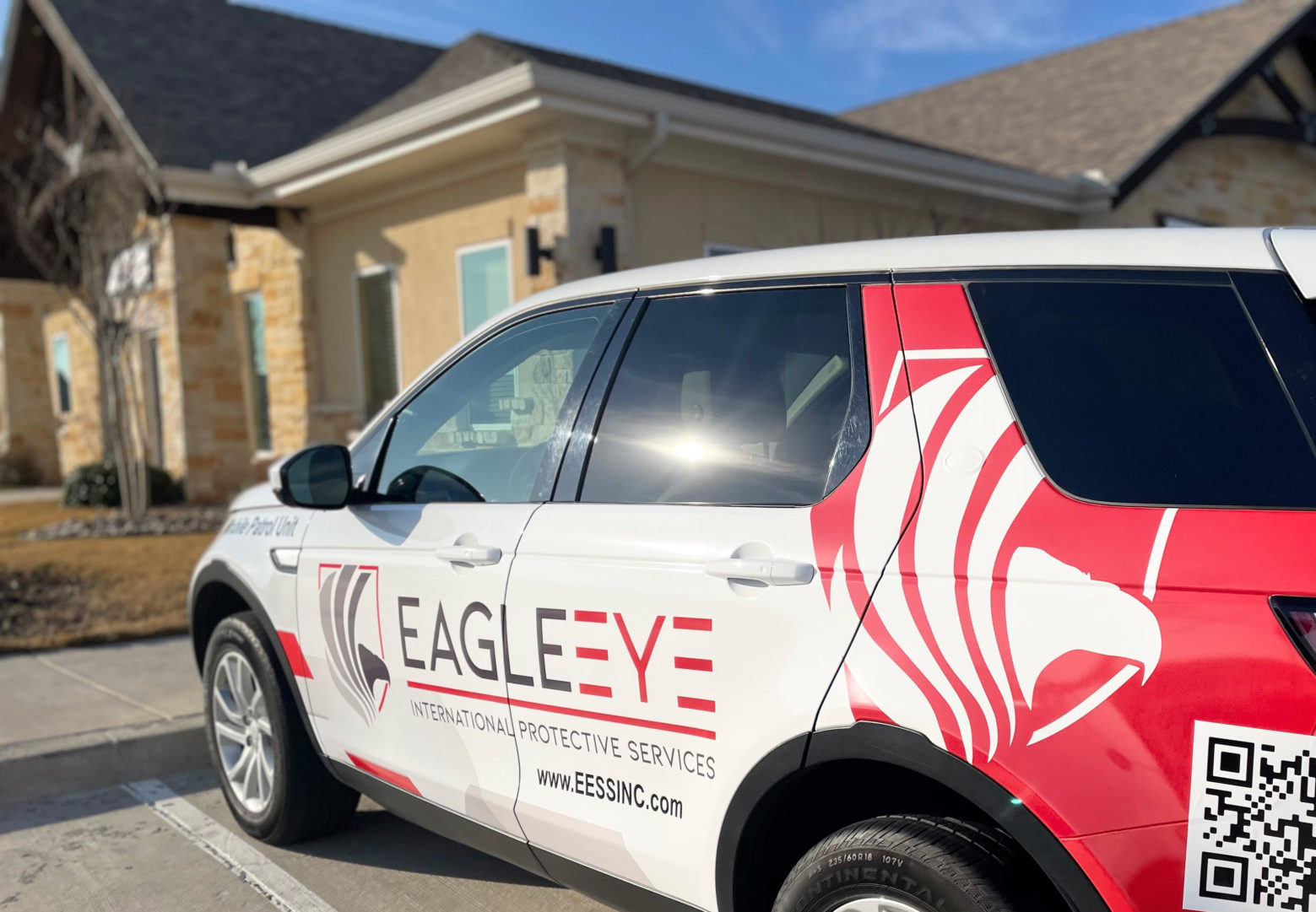 Eagle Eye Protective services Mobile patrol vehicle parked outside of a building