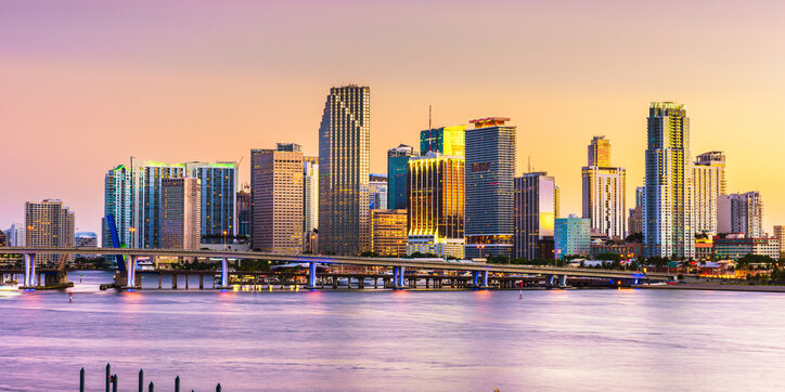 Miami, FL skyline at dusk.