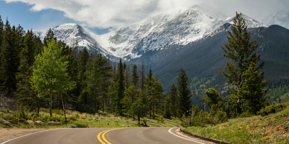 Road heading towards Rocky Mountains in Colorado